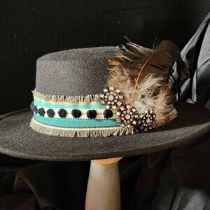 New, black fedora hat with original decorations.